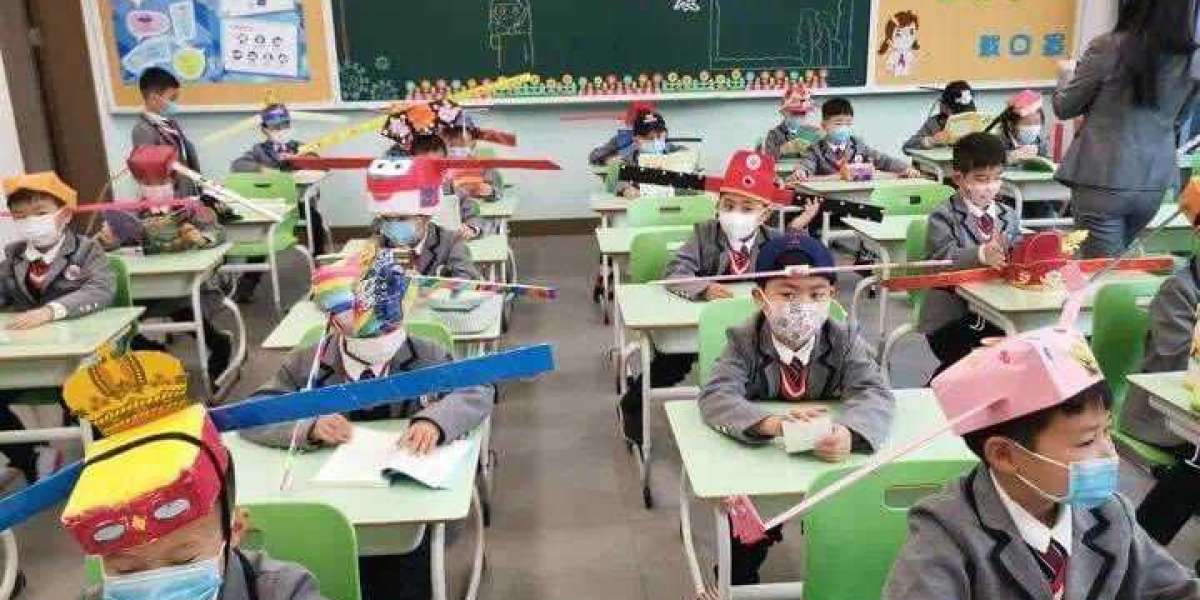 Students wear social distancing headgears to class as schools resume in China