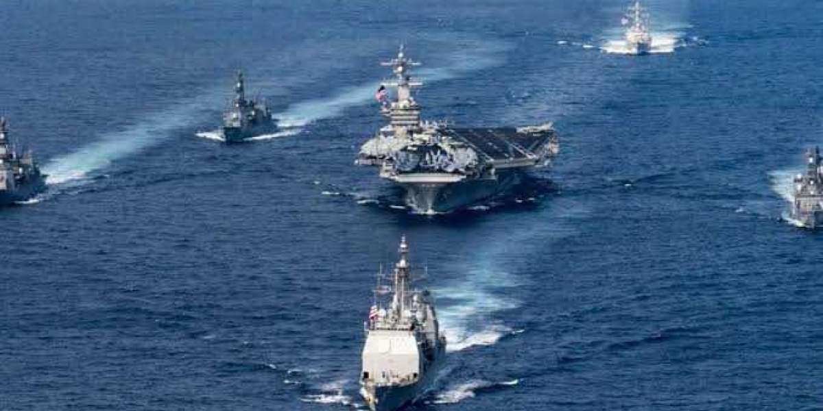 US and China deploy aircraft carriers and assault ships in South China Sea at the same time as tensions continue to grow